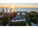 Beach house boasts scenic ocean views, mature landscaping, and a tranquil coastal setting at 8030 Manasota Key Rd, Englewood, FL 34223