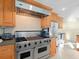 Well-equipped kitchen featuring stainless steel appliances and a professional-grade range at 8030 Manasota Key Rd, Englewood, FL 34223