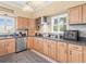 Well-equipped kitchen with modern appliances, ample counter space, and natural wood cabinets at 8030 Manasota Key Rd, Englewood, FL 34223