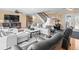 Living room with neutral furnishings, ceiling fan, and doorway to a bedroom at 8030 Manasota Key Rd, Englewood, FL 34223