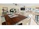 Spacious living room seamlessly connects to the kitchen and offers views of the beach at 8030 Manasota Key Rd, Englewood, FL 34223