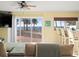 Comfortable living room with a large sliding glass door offering beach views at 8030 Manasota Key Rd, Englewood, FL 34223