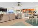 Open floor plan with a living room, dining area, and kitchen overlooking the ocean at 8030 Manasota Key Rd, Englewood, FL 34223