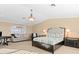 Bright main bedroom with seating area, ensuite, and lots of natural light at 8030 Manasota Key Rd, Englewood, FL 34223