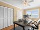 Bright home office with desk, computer, and windows offering views of the beach at 8030 Manasota Key Rd, Englewood, FL 34223