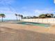 Pool featuring a beach view and mature palms at 8030 Manasota Key Rd, Englewood, FL 34223