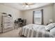 Comfortable bedroom with neutral color scheme and large window for natural light at 10742 Verawood Dr, Riverview, FL 33579