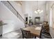 Dining area with wood table, rug, and view of staircase and living room at 10742 Verawood Dr, Riverview, FL 33579