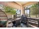 Outdoor patio with cooking area, cat tower, overhead shade and tile flooring at 10742 Verawood Dr, Riverview, FL 33579