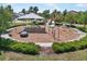 Well-maintained playground area with diverse play structures and safety surfacing, surrounded by lush landscaping at 10742 Verawood Dr, Riverview, FL 33579