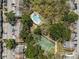 Aerial view showing the pool and tennis court in the townhouse community at 11357 Stratton Park Dr # 11357, Temple Terrace, FL 33617