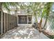 This backyard features a screened porch, palm trees, fenced yard, and outdoor space at 11357 Stratton Park Dr # 11357, Temple Terrace, FL 33617