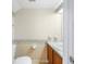 The half bathroom features decorative floral wallpaper, a single sink, and updated fixtures at 11357 Stratton Park Dr # 11357, Temple Terrace, FL 33617