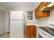 Cozy kitchen featuring wood cabinets and white countertops at 11357 Stratton Park Dr # 11357, Temple Terrace, FL 33617