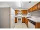 Functional kitchen with white appliances and ample cabinet space at 11357 Stratton Park Dr # 11357, Temple Terrace, FL 33617