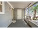 This screened-in porch provides a comfortable outdoor area with an entrance door and view of the yard at 11357 Stratton Park Dr # 11357, Temple Terrace, FL 33617