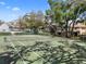 Well-maintained community tennis court surrounded by mature trees at 11357 Stratton Park Dr # 11357, Temple Terrace, FL 33617