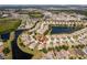 Aerial view of the neighborhood, highlighting the property's location with pond and mature trees at 11466 Captiva Kay Dr, Riverview, FL 33569