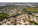 Overhead view of the property showing proximity to lakes, other homes and retail areas in a picturesque community at 11466 Captiva Kay Dr, Riverview, FL 33569