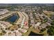 Aerial view of the property showing its location within a well-established community, ponds, and mature trees at 11466 Captiva Kay Dr, Riverview, FL 33569
