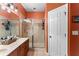 Well-maintained bathroom showcasing a vanity with a shower and a glass door, designed for functionality and style at 11466 Captiva Kay Dr, Riverview, FL 33569