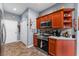 Bright kitchen featuring stainless steel appliances, wood cabinets, and a tiled backsplash with overhead microwave at 11466 Captiva Kay Dr, Riverview, FL 33569