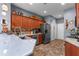 Updated kitchen with stainless steel appliances, plenty of cabinets, and tile flooring at 11466 Captiva Kay Dr, Riverview, FL 33569