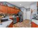 Well-organized kitchen features stainless steel appliances, tile backsplash and ample counter space at 11466 Captiva Kay Dr, Riverview, FL 33569