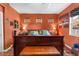 Well-lit main bedroom featuring a dark wood bed frame, matching dressers, and art at 11466 Captiva Kay Dr, Riverview, FL 33569