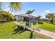 This home features a dock and screened-in pool area, providing the perfect setting for relaxing outdoors and enjoying the waterfront at 11506 Harbourside Ln, Parrish, FL 34219