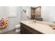 Well-lit bathroom featuring a single vanity, toilet, and a tiled walk-in shower at 11506 Harbourside Ln, Parrish, FL 34219
