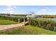 This private dock with boat lift access provides easy access to waterfront activities from the home's backyard at 11506 Harbourside Ln, Parrish, FL 34219