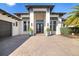 Stunning home with a paved driveway and manicured landscaping at 11506 Harbourside Ln, Parrish, FL 34219