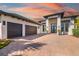 Beautiful home featuring three-car garage with spacious driveway at 11506 Harbourside Ln, Parrish, FL 34219