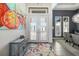 Welcoming foyer features tile floors, double doors and a colorful art collection at 11506 Harbourside Ln, Parrish, FL 34219