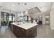 Open floor plan with a kitchen island, modern cabinets and stainless appliances at 11506 Harbourside Ln, Parrish, FL 34219