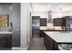 Beautiful kitchen featuring stainless steel appliances, dark cabinets and modern countertops at 11506 Harbourside Ln, Parrish, FL 34219