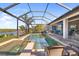 This stunning pool features a built-in spa, screened enclosure, and gorgeous waterfront views in a beautiful Florida home at 11506 Harbourside Ln, Parrish, FL 34219