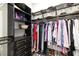 Organized walk-in closet with custom shelving and ample storage space for clothing and accessories at 11506 Harbourside Ln, Parrish, FL 34219