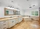 Bathroom features double vanity with marble countertop, jacuzzi tub, ceramic tile and recessed lights at 13004 Bell Creek Chase, Riverview, FL 33569