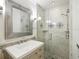 Bathroom featuring single sink vanity and glass enclosed shower with decorative tile accents at 13004 Bell Creek Chase, Riverview, FL 33569