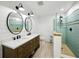 Bathroom featuring a double vanity with a modern sink, tiled shower, and contemporary fixtures at 13004 Bell Creek Chase, Riverview, FL 33569