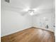 Bedroom featuring light hardwood floors and french doors with views of the exterior at 13004 Bell Creek Chase, Riverview, FL 33569