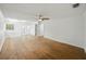 Bright bedroom with hardwood floors, ceiling fan, neutral decor and doors leading to patio at 13004 Bell Creek Chase, Riverview, FL 33569