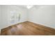 This primary bedroom features beautiful hardwood floors and a set of french doors at 13004 Bell Creek Chase, Riverview, FL 33569