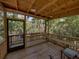 Outdoor deck with a tranquil river view, complete with seating, lighting, and a wooden railing at 13004 Bell Creek Chase, Riverview, FL 33569