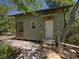 Charming cottage-style home featuring an open porch, brick foundation and a natural setting at 13004 Bell Creek Chase, Riverview, FL 33569
