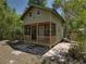 Charming cottage-style home featuring a cozy screened-in porch, brick foundation and a natural setting at 13004 Bell Creek Chase, Riverview, FL 33569