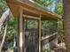 Rustic gazebo enveloped by trees, providing a secluded and peaceful outdoor space at 13004 Bell Creek Chase, Riverview, FL 33569