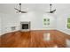 Spacious living room featuring hardwood floors, fireplace and custom built-in cabinets at 13004 Bell Creek Chase, Riverview, FL 33569